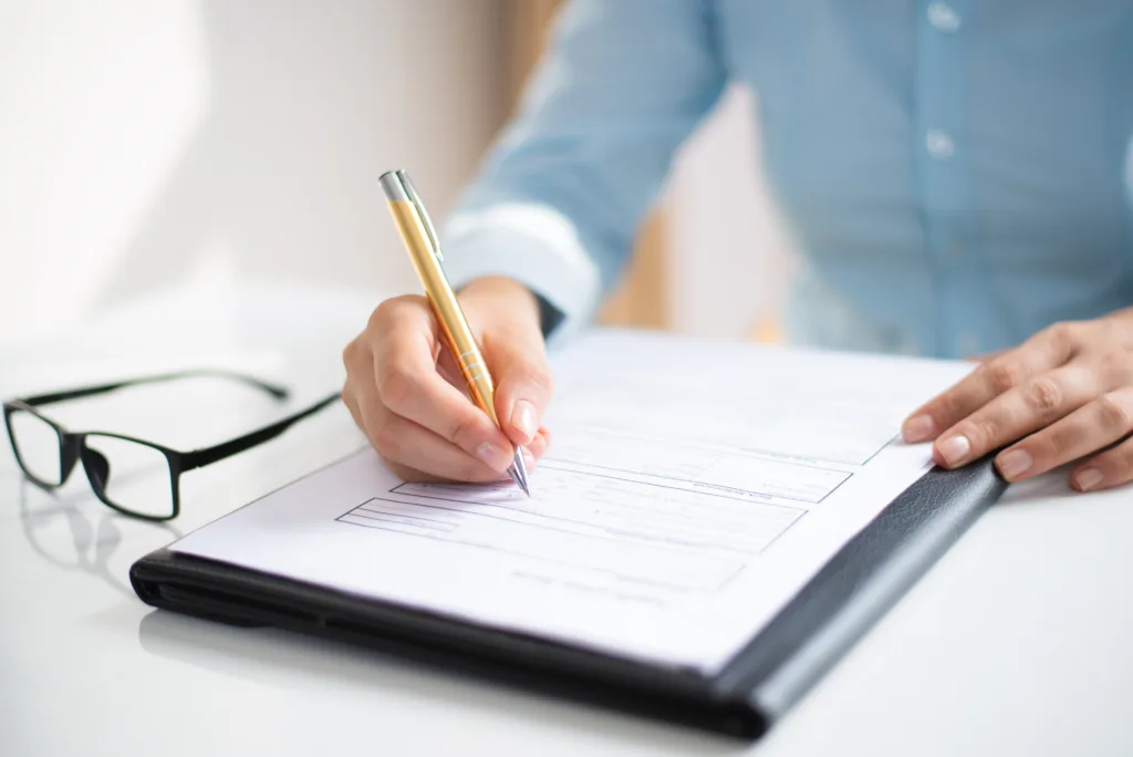 Closeup business woman making notes document 1024x684.webp.webp